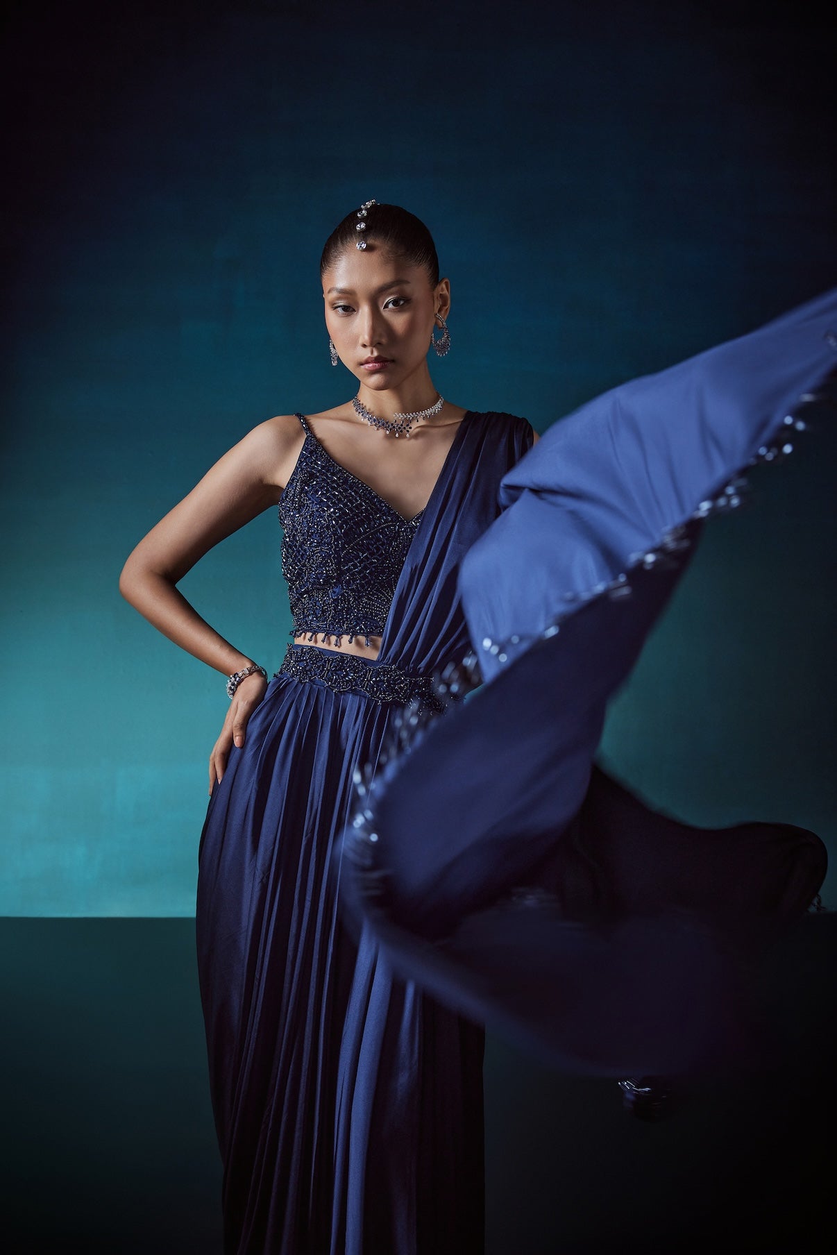 NAVY DRAPE SAREE WITH CRYSTAL STUDDED BLOUSE