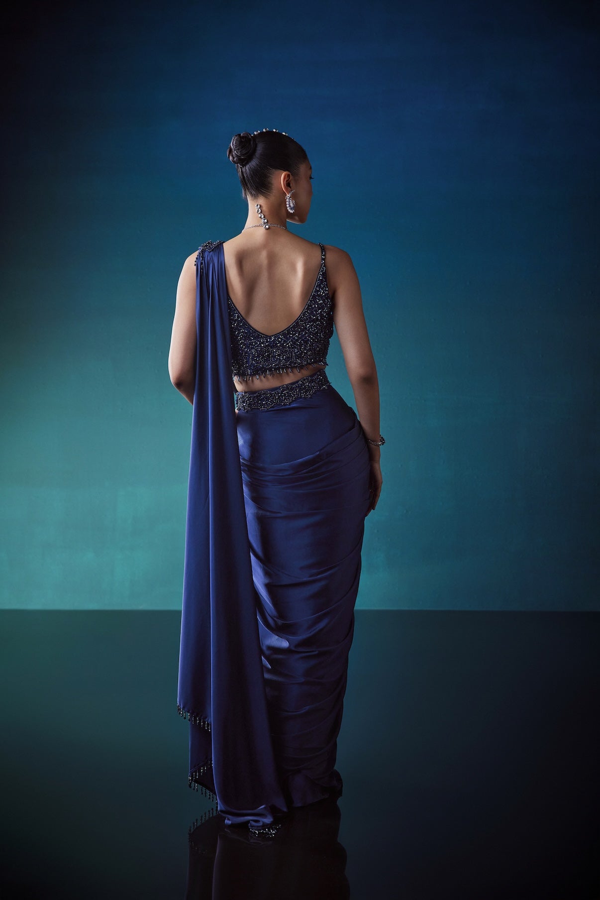 NAVY DRAPE SAREE WITH CRYSTAL STUDDED BLOUSE