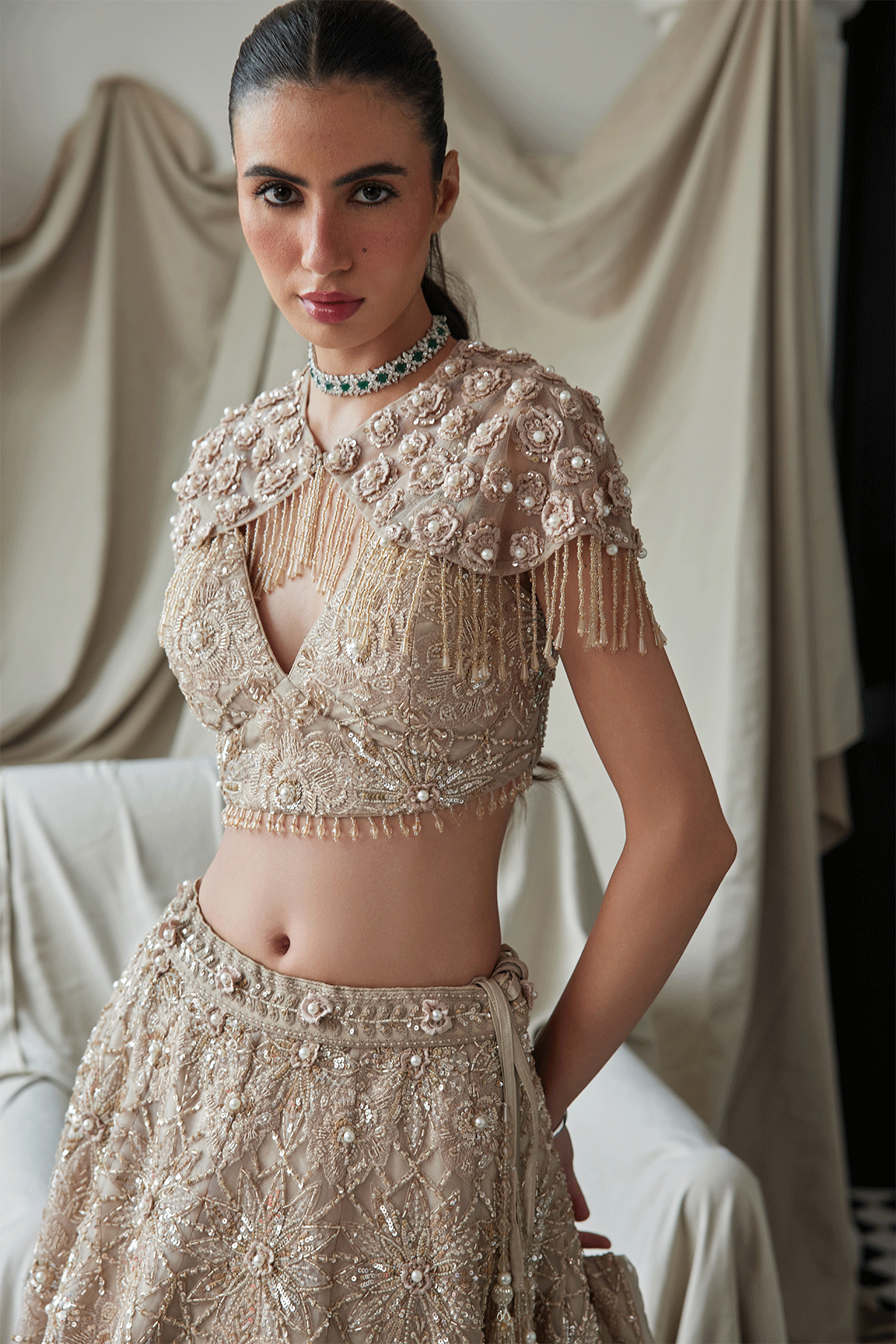 BEIGE LEHENGA WITH AN EMBELLISHED SHOULDER CAPE