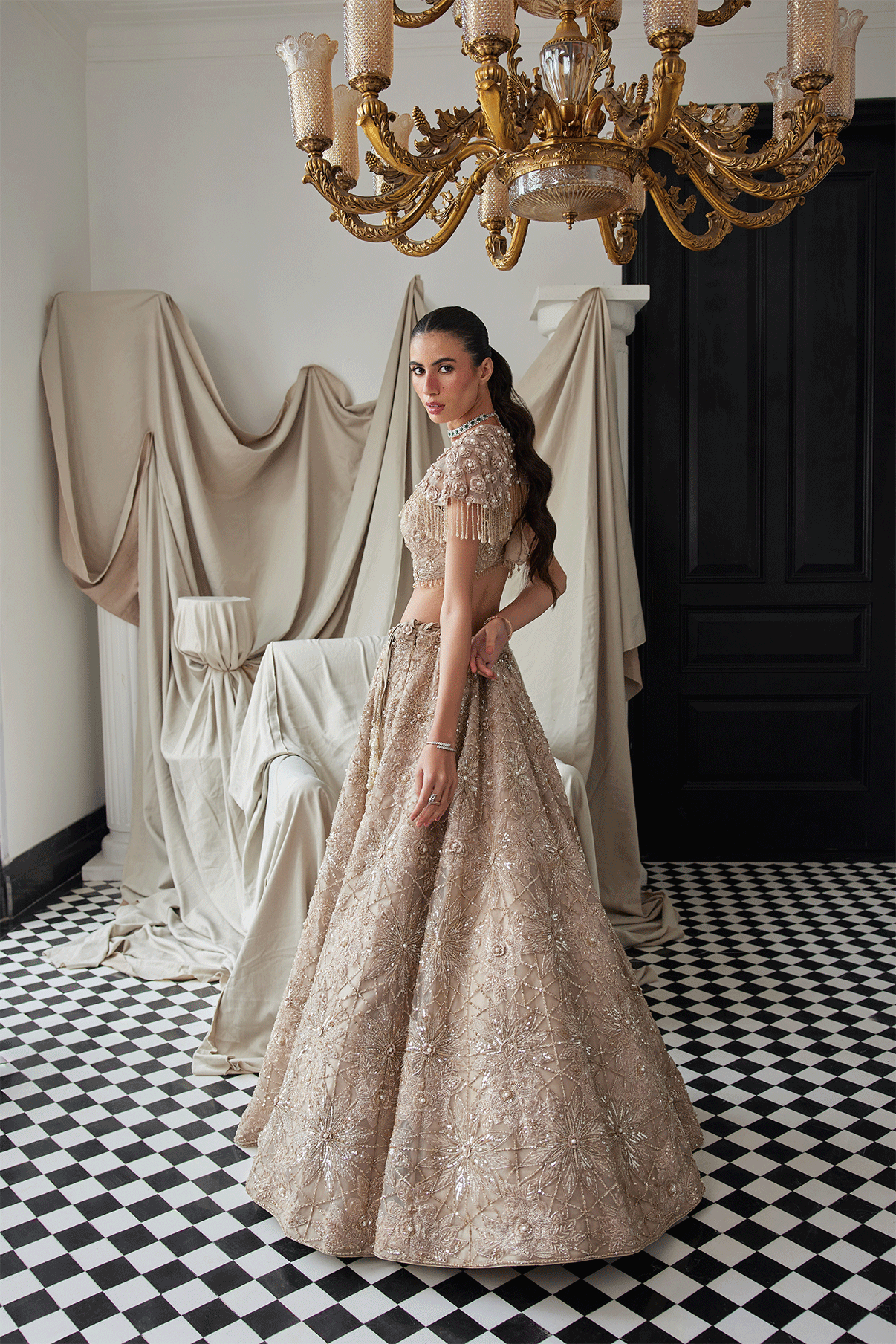 BEIGE LEHENGA WITH AN EMBELLISHED SHOULDER CAPE