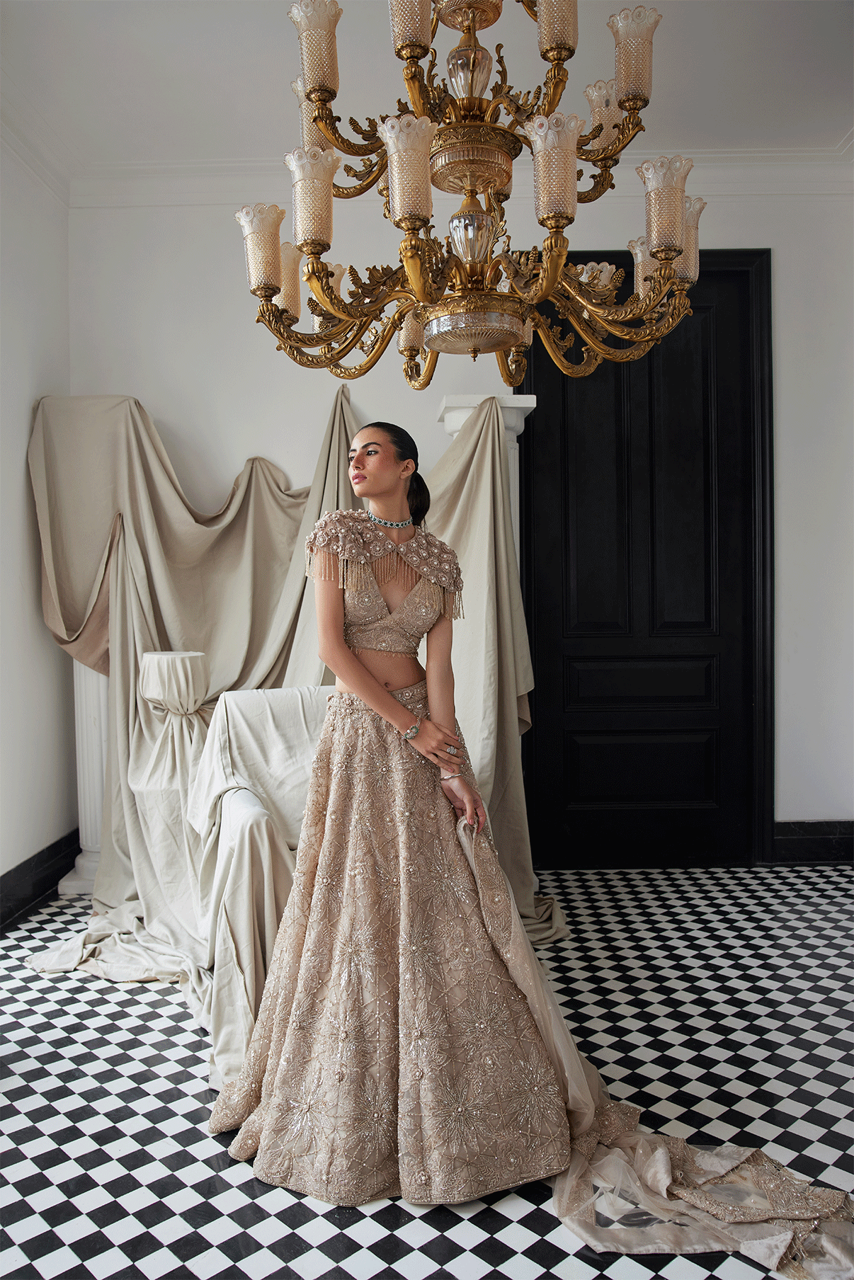 BEIGE LEHENGA WITH AN EMBELLISHED SHOULDER CAPE