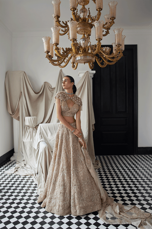 BEIGE LEHENGA WITH AN EMBELLISHED SHOULDER CAPE