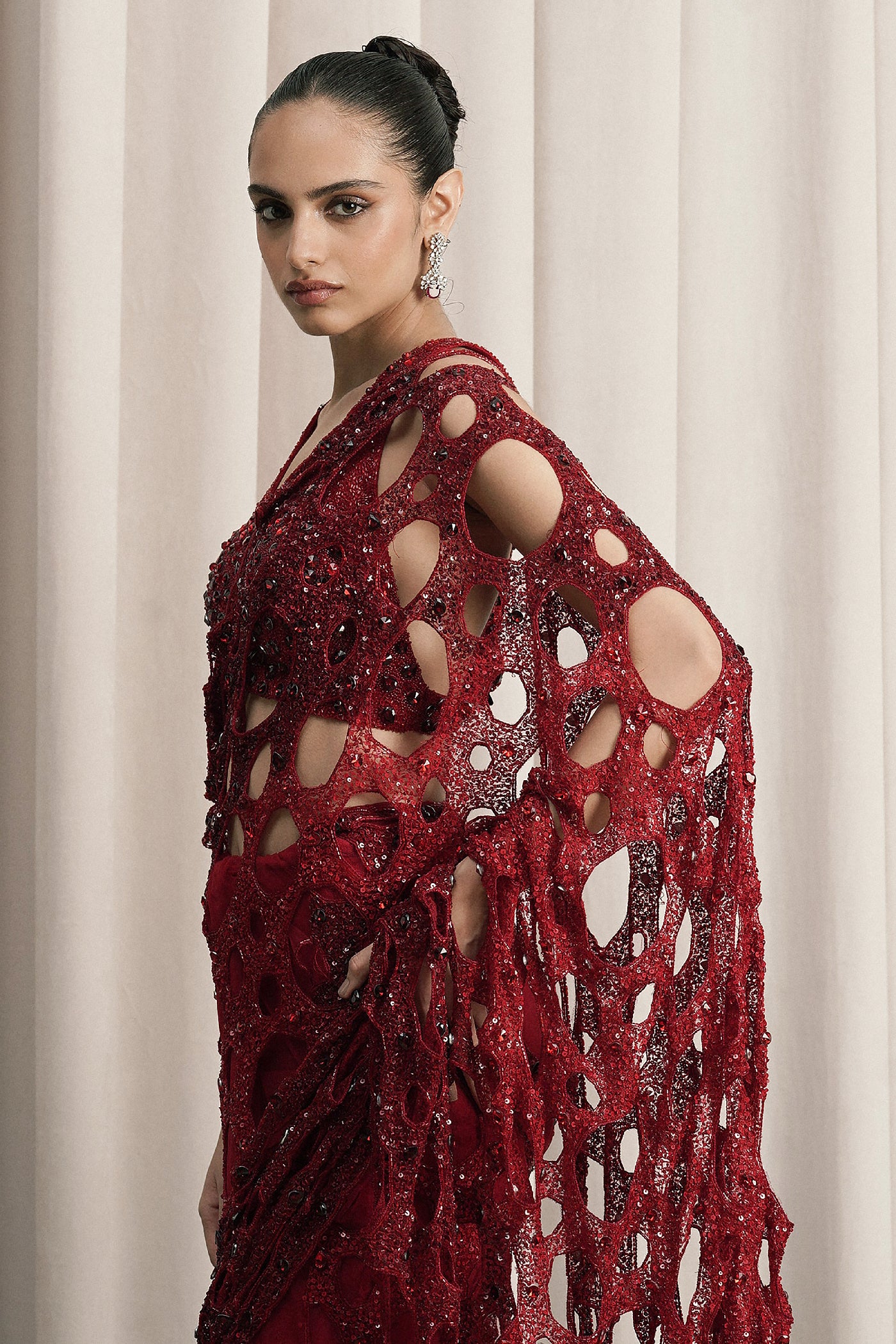 RED NET SAREE WITH HALTER-NECK BLOUSE